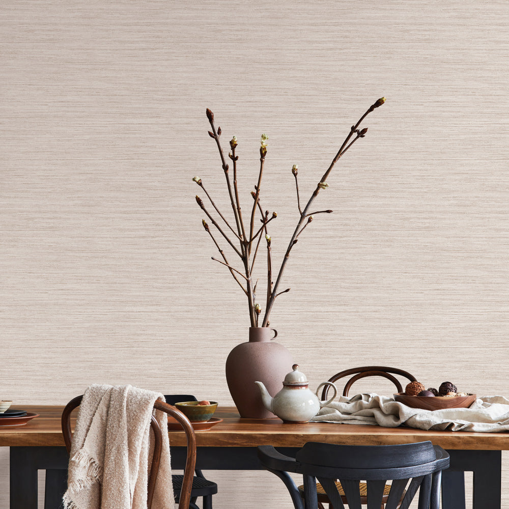 Faux horizontal grasscloth peel and stick wallpaper behind a table and chairs