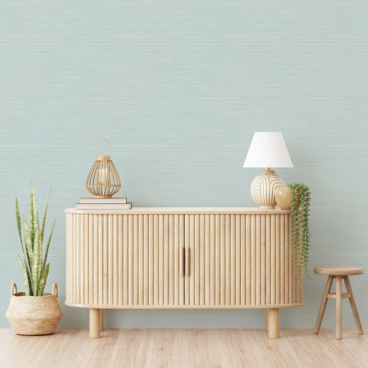 Faux Horizontal Grasscloth Removable Wallpaper - A wood dresser in a room featuring Faux Horizontal Grasscloth Peel And Stick Wallpaper in textured seaglass | Tempaper#color_textured-seaglass