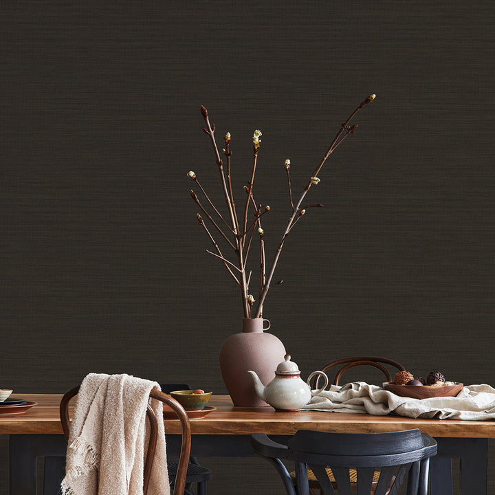 Faux Horizontal Grasscloth Removable Wallpaper - A dining room with a wood table and chairs featuring Faux Horizontal Grasscloth Peel And Stick Wallpaper in textured black raven | Tempaper#color_textured-black-raven