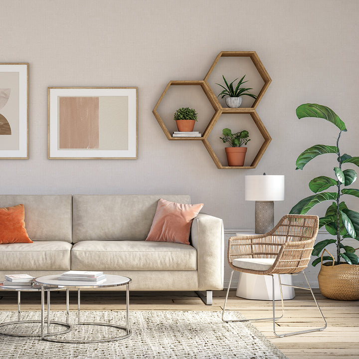 Burlap Removable Wallpaper - A tan couch, silver coffee table, and chair in a room featuring Burlap Peel And Stick Wallpaper in linen burlap | Tempaper#color_linen-burlap