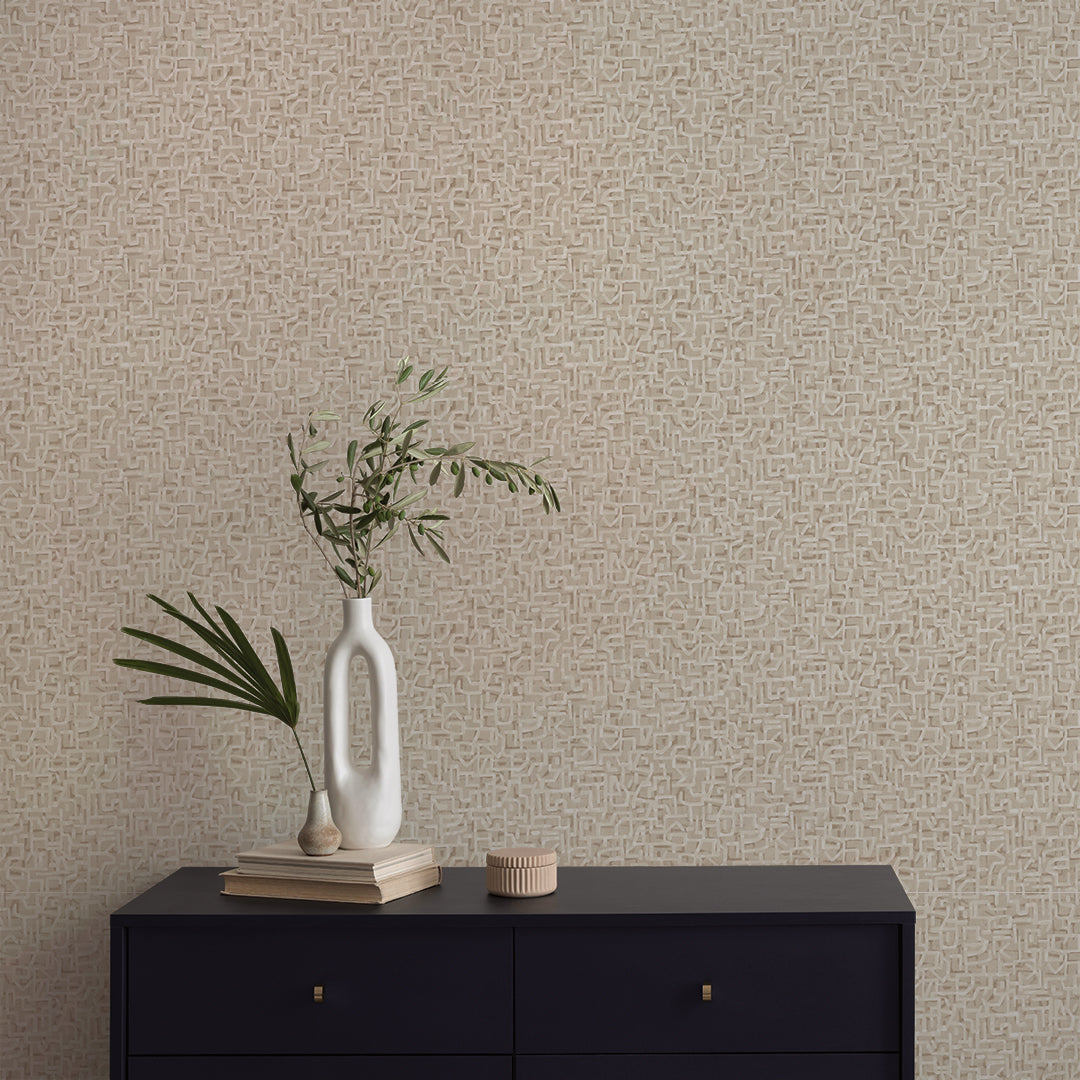 Glyph Geo Non-Pasted Wallpaper - A black dresser with plants in white vases in front of Glyph Geo Unpasted Wallpaper in fawn geo | Tempaper#color_fawn-geo