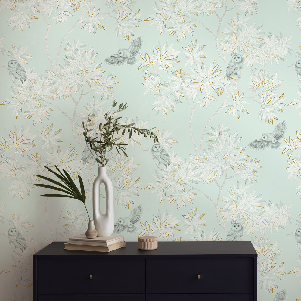 Parliament Non-Pasted Wallpaper - A black dresser and plants with Parliament Unpasted Wallpaper in celeste | Tempaper#color_celeste