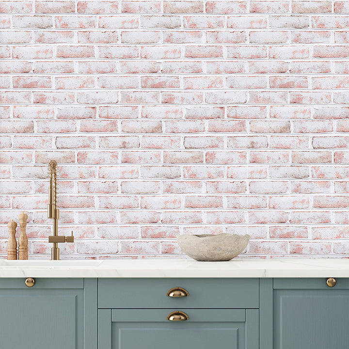 Tempaper's Whitewashed Brick Peel And Stick Wallpaper shown in a kitchen behind a sink.