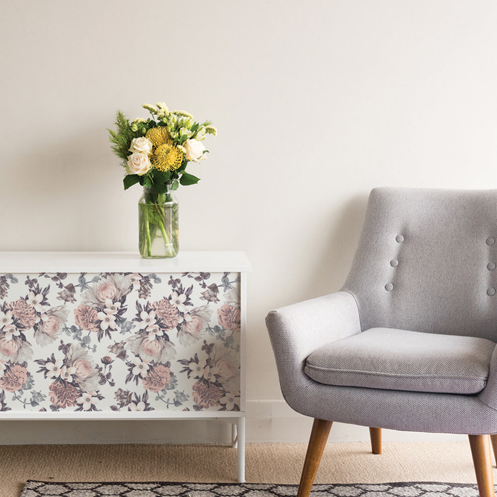 Botanical WALLPAPER displayed on a cabinet.