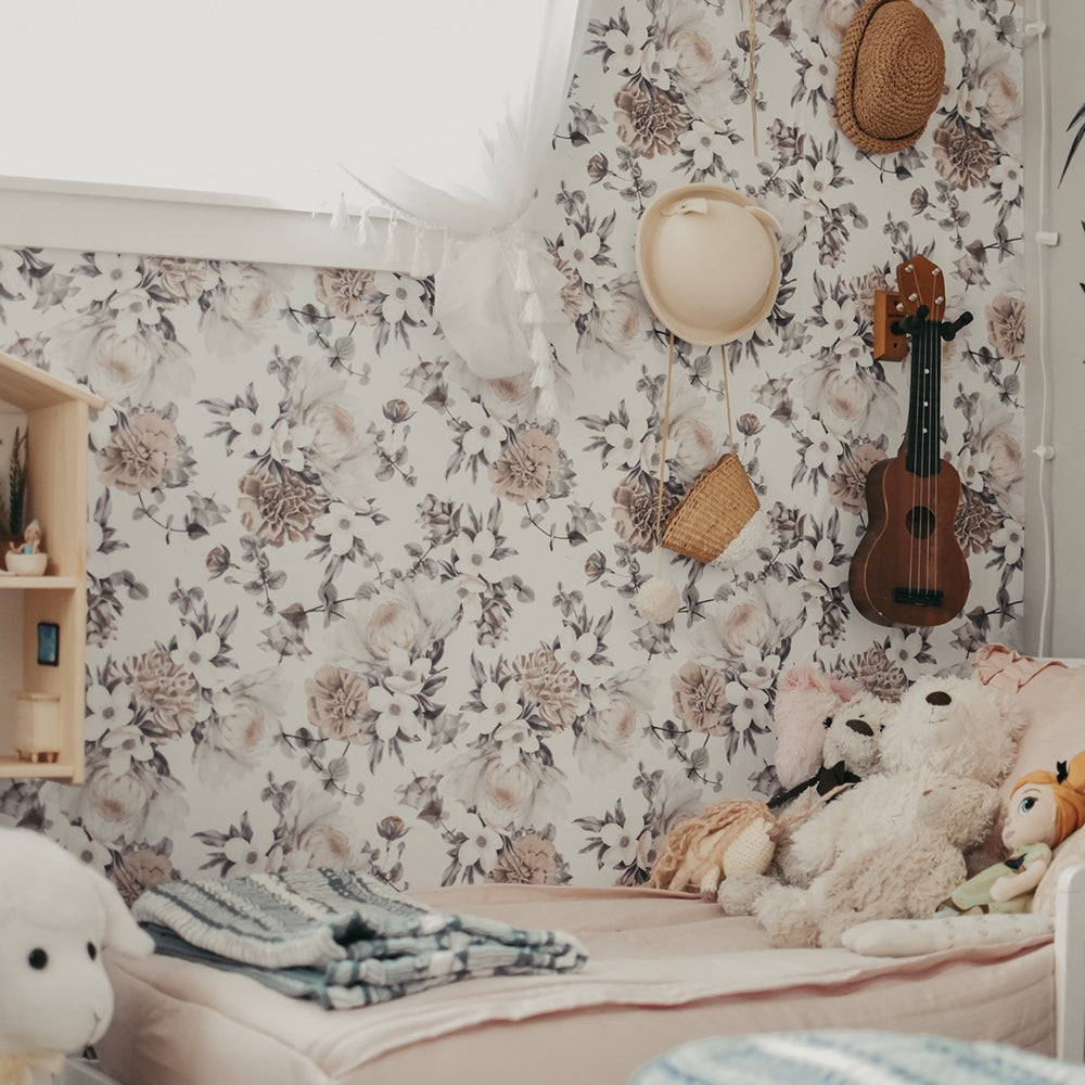 Botanical WALLPAPER in mauve pink displayed in a kid's room.