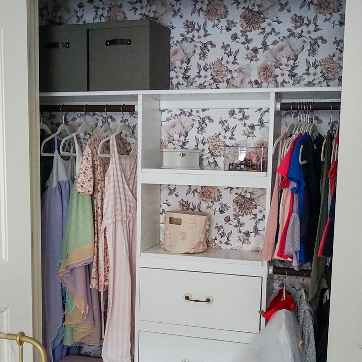 Botanical WALLPAPER in mauve pink displayed in a kid's closet.