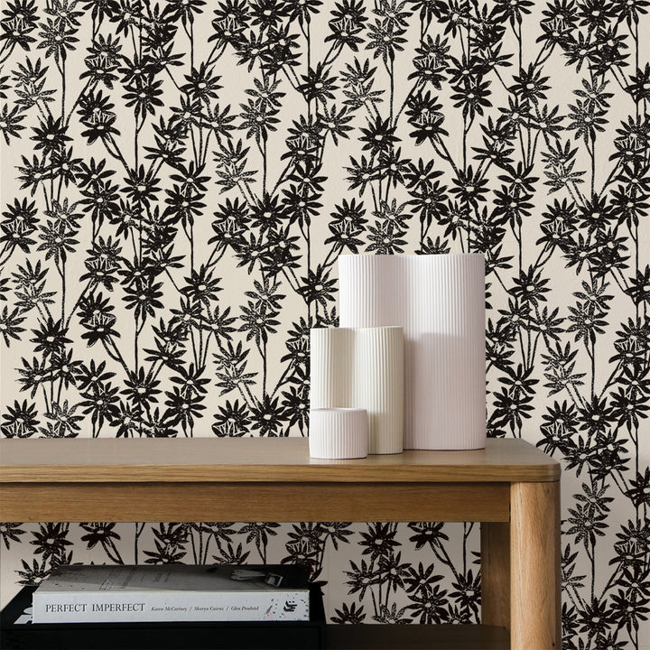 Tempaper's Daisy Bloom Peel And Stick Wallpaper By Novogratz shown behind a desk.