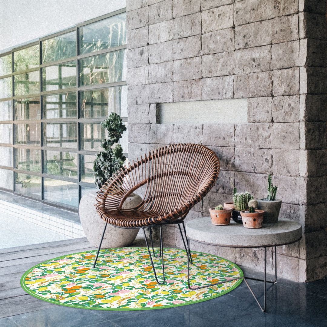 Tempaper's Citrus Vinyl Rug shown under a chair.#color_green-citrus