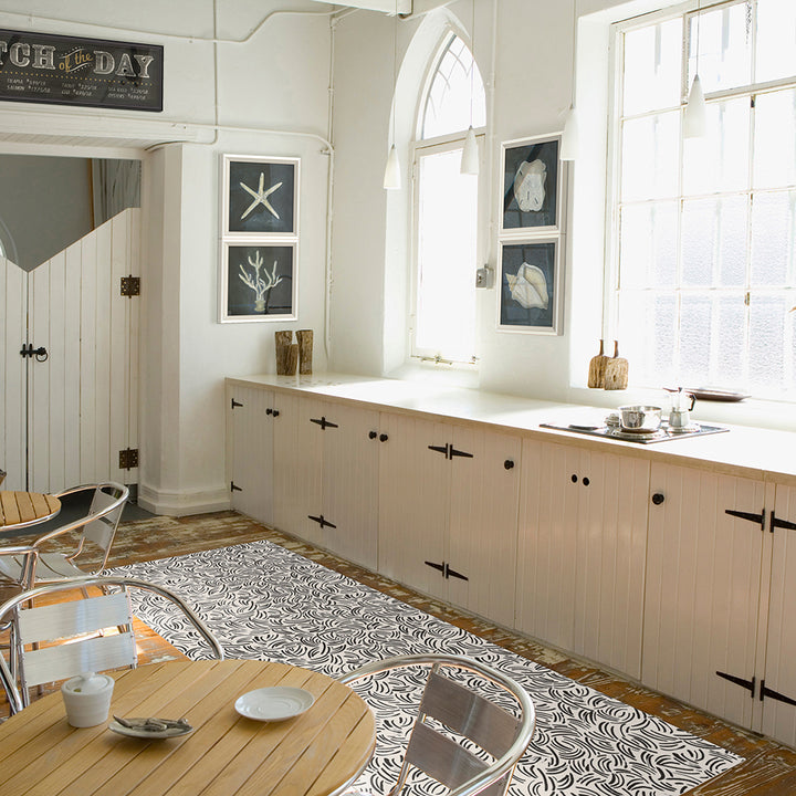 Abstract Lines Vinyl Rug shown in a kitchen space.